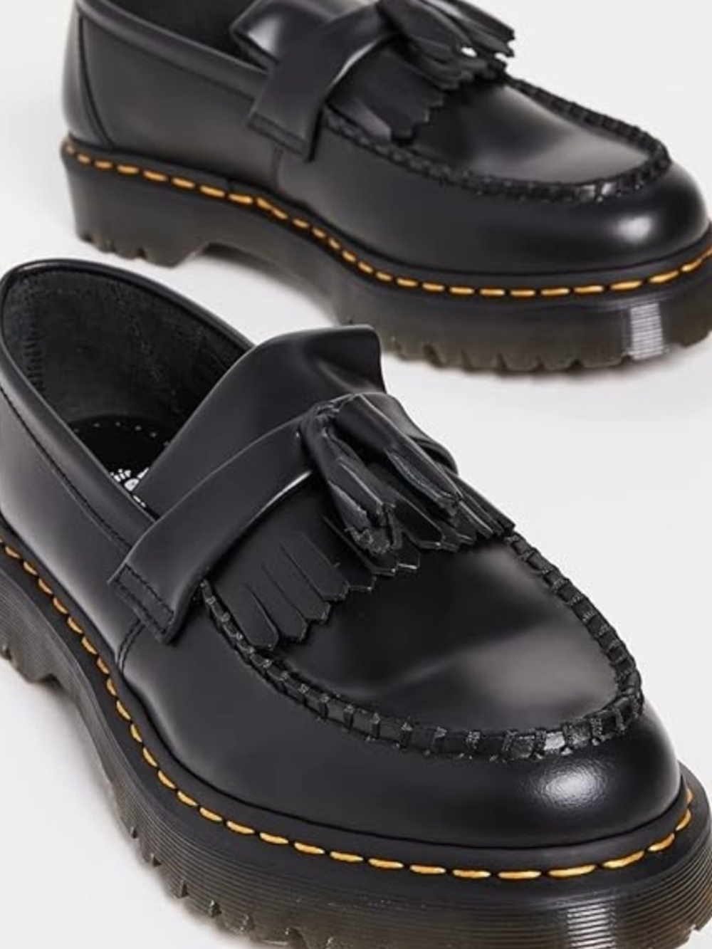 Dr. Martens Black Tassel Kiltie Lug Loafers with Yellow Stitching